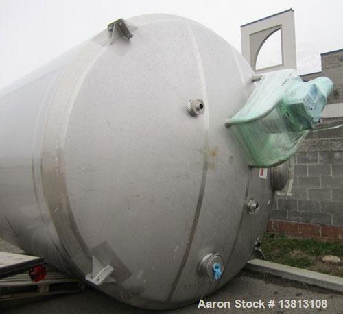 Used DCI Insulated Stainless Steel Mixing Tank, 6,000 Gallon.  Top agitated, flat bottom, stainless steel, top manway and 1 spray ball.  4 Top inlets:  (2) 5", (1) 8", (1) 2";  3 outlets:  2.5", 3" a...