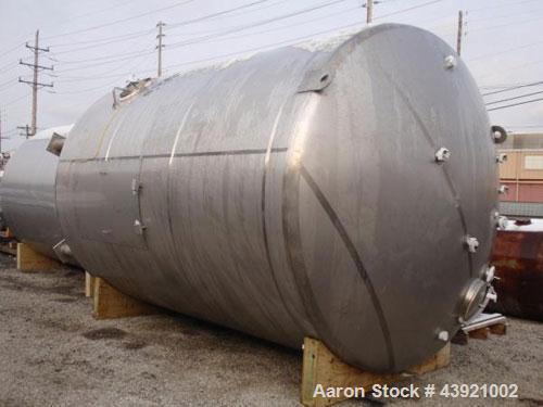 Used 10000 gallon DCI storage tank, 316L stainless  steel construction, 132" inner diameter x 160" straight side, dish top and bottom, 18" top manway, 6", 4", (3)3" top ports, 16" x 20" side bottom m...