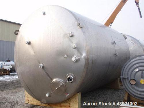 Used 10000 gallon DCI storage tank, 316L stainless  steel construction, 132" inner diameter x 160" straight side, dish top and bottom, 18" top manway, 6", 4", (3)3" top ports, 16" x 20" side bottom m...