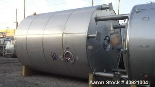 Used 10000 Gallon DCI Storage Tank, 316L stainless  steel construction.  132" Inner diameter x 160" straight side, dish top and bottom, 18" top manway, 6", 4", (3) 3" top ports, 16" x 20" side bottom...