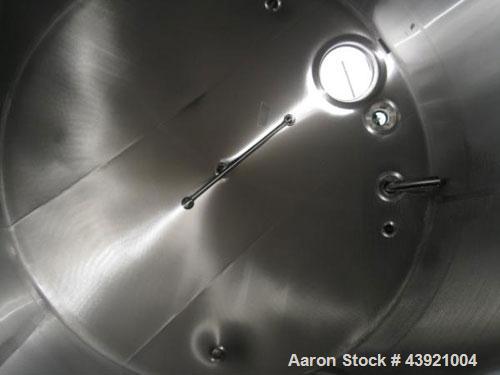 Used 10000 Gallon DCI Storage Tank, 316L stainless  steel construction.  132" Inner diameter x 160" straight side, dish top and bottom, 18" top manway, 6", 4", (3) 3" top ports, 16" x 20" side bottom...