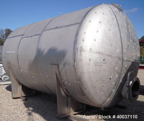 Used: Douglas Brothers pressure tank, 8970 gallon, stainless steel, horizontal. Approximately 114" diameter x 14' long, dished ends. Internal rated 35 psi at 200 deg.f.. (6) top nozzles, 18" end manw...