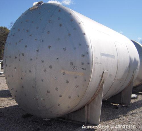 Used: Douglas Brothers pressure tank, 8970 gallon, stainless steel, horizontal. Approximately 114" diameter x 14' long, dished ends. Internal rated 35 psi at 200 deg.f.. (6) top nozzles, 18" end manw...