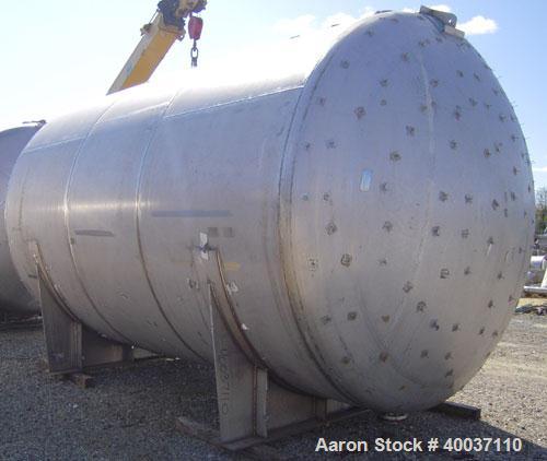 Used: Douglas Brothers pressure tank, 8970 gallon, stainless steel, horizontal. Approximately 114" diameter x 14' long, dished ends. Internal rated 35 psi at 200 deg.f.. (6) top nozzles, 18" end manw...