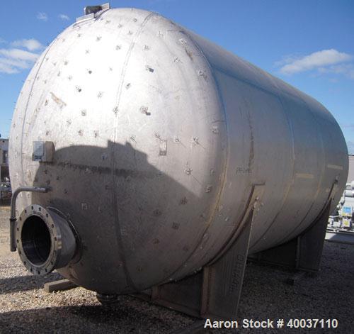 Used: Douglas Brothers pressure tank, 8970 gallon, stainless steel, horizontal. Approximately 114" diameter x 14' long, dished ends. Internal rated 35 psi at 200 deg.f.. (6) top nozzles, 18" end manw...