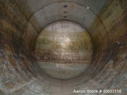 Used: Douglas Brothers pressure tank, 8970 gallon, stainless steel, horizontal. Approximately 114" diameter x 14' long, dished ends. Internal rated 35 psi at 200 deg.f.. (6) top nozzles, 18" end manw...