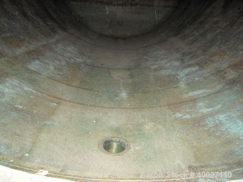 Used: Douglas Brothers pressure tank, 8970 gallon, stainless steel, horizontal. Approximately 114" diameter x 14' long, dished ends. Internal rated 35 psi at 200 deg.f.. (6) top nozzles, 18" end manw...