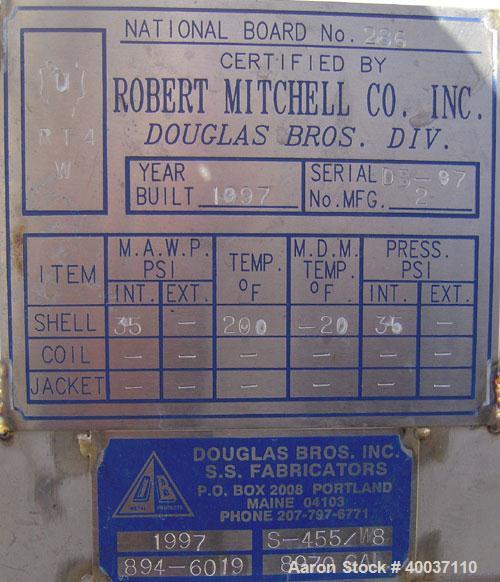 Used: Douglas Brothers pressure tank, 8970 gallon, stainless steel, horizontal. Approximately 114" diameter x 14' long, dished ends. Internal rated 35 psi at 200 deg.f.. (6) top nozzles, 18" end manw...