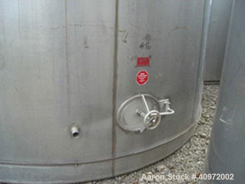 Used Ellet Tank, approximately 13,000 gallon, 304 stainless steel, vertical. 14'6" diameter x 10'6" straight side. Flat top and sloping bottom. 3 jacket rings located near the top of the tank for coo...