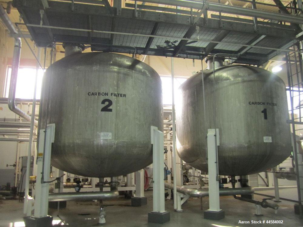 Used Enerfab Inc Vertical Tank. Approximately 7000 gallons, stainless steel. Approximately 12 ft diameter x 6 ft straight side.  Dished heads . Internal rated 125 psi @ 100 deg F.  4  Steel leg mount...
