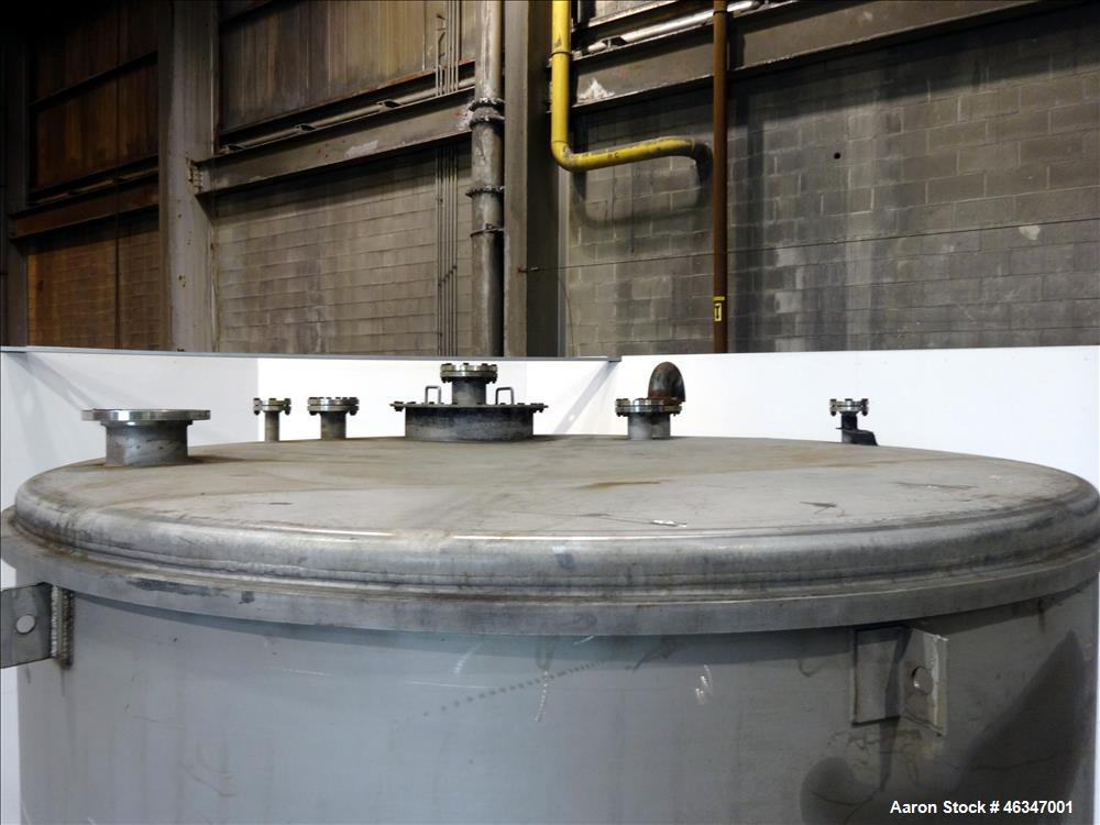 Used Evans & Sons Tank, 9000 Gallon, 316 Stainless Steel, Vertical. Approximate 126” diameter x 168” straight side, flat top and bottom. Internal atmospheric at 150 degrees F. Openings top (2) 2”, (3...