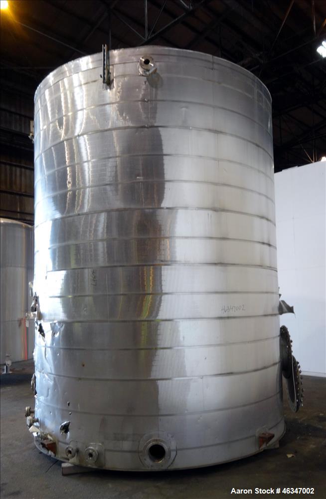 Used Evans & Sons Tank, 9000 Gallon, 316 Stainless Steel, Vertical. Approximate 126” diameter x 168” straight side, flat top and bottom. Internal atmospheric at 150 degrees F. Openings top 2”, (4) 4”...