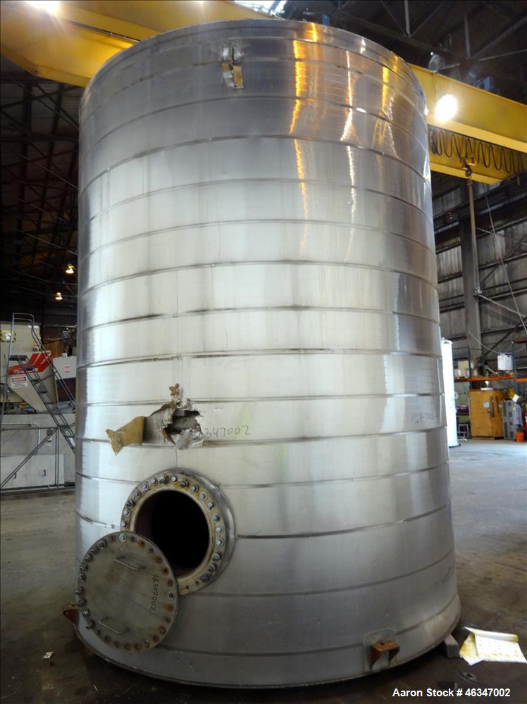 Used Evans & Sons Tank, 9000 Gallon, 316 Stainless Steel, Vertical. Approximate 126” diameter x 168” straight side, flat top and bottom. Internal atmospheric at 150 degrees F. Openings top 2”, (4) 4”...