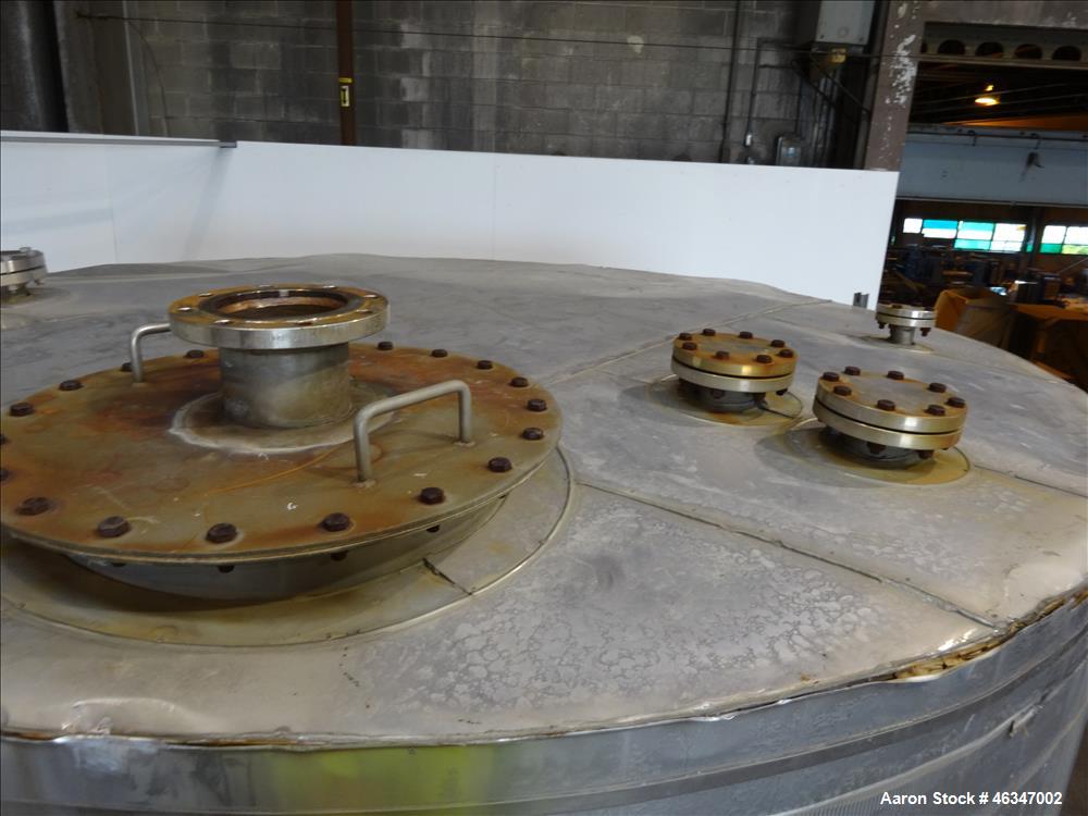 Used Evans & Sons Tank, 9000 Gallon, 316 Stainless Steel, Vertical. Approximate 126” diameter x 168” straight side, flat top and bottom. Internal atmospheric at 150 degrees F. Openings top 2”, (4) 4”...