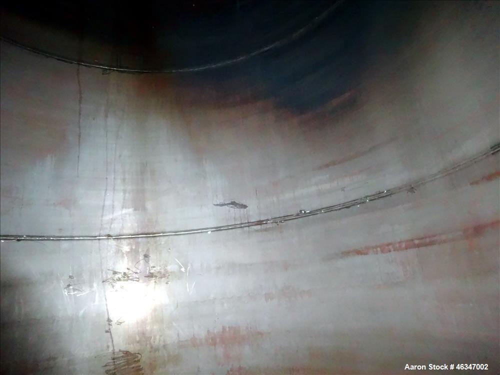 Used Evans & Sons Tank, 9000 Gallon, 316 Stainless Steel, Vertical. Approximate 126” diameter x 168” straight side, flat top and bottom. Internal atmospheric at 150 degrees F. Openings top 2”, (4) 4”...