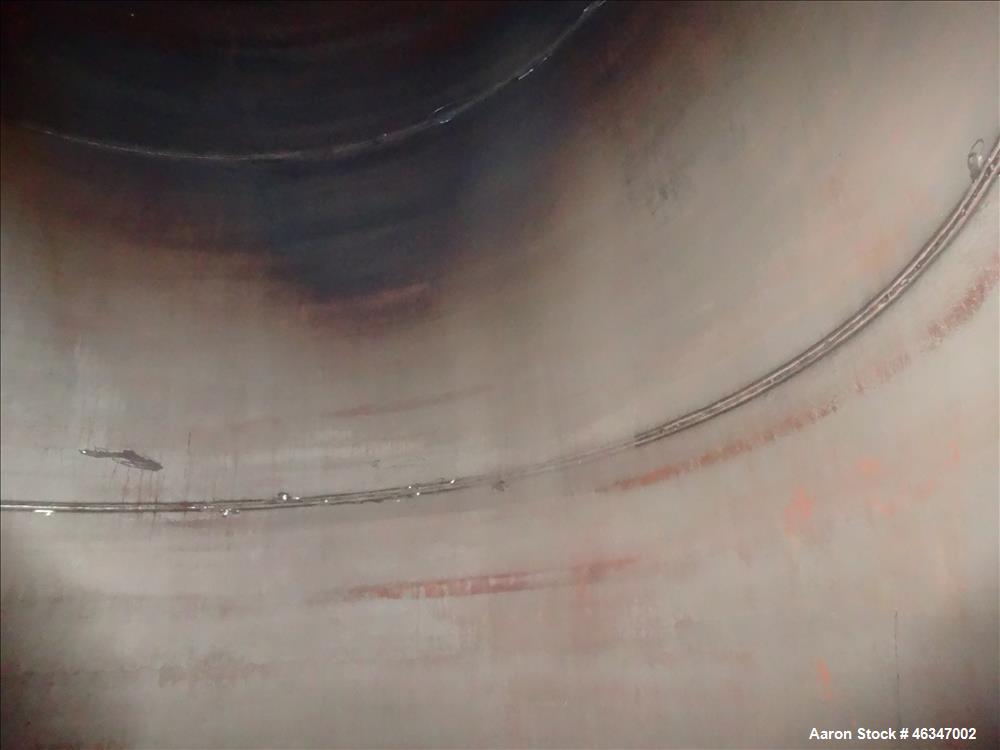 Used Evans & Sons Tank, 9000 Gallon, 316 Stainless Steel, Vertical. Approximate 126” diameter x 168” straight side, flat top and bottom. Internal atmospheric at 150 degrees F. Openings top 2”, (4) 4”...