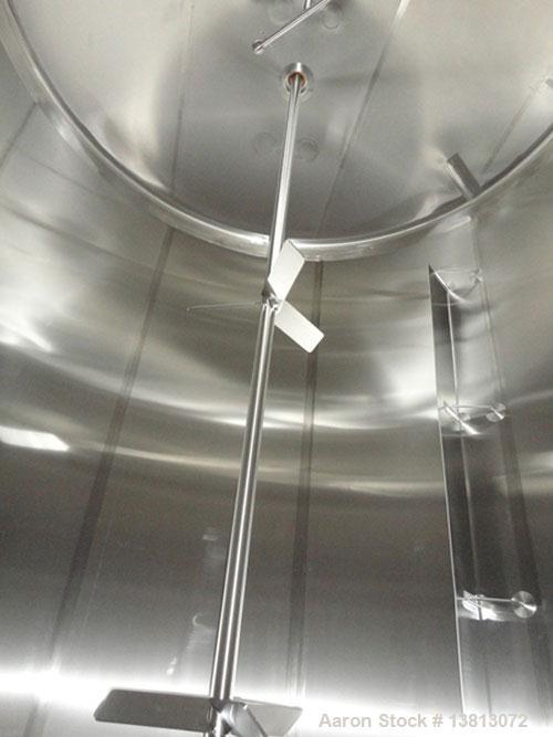 Used Feldmeier 10,000 Gallon Top Agitated Mix Tank. Includes 5 hp, 3485 rpm, Tri Clover 2 1/2" x 1 1/2" transfer pump. Dish top and dish bottom with side manway. (3) Sets of 3 blade mixing propellers...
