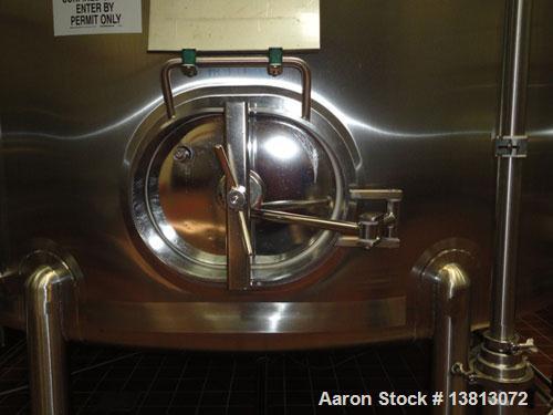 Used Feldmeier 10,000 Gallon Top Agitated Mix Tank. Includes 5 hp, 3485 rpm, Tri Clover 2 1/2" x 1 1/2" transfer pump. Dish top and dish bottom with side manway. (3) Sets of 3 blade mixing propellers...