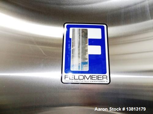 Used Feldmeier 9,000 Gallon Vertical Storage Tank, Stainless Steel. Dish top and dish bottom with center 6" 150lb discharge flange and adjacent 3" outlet. 8" 150 lb flange upper side inlet. Bottom si...