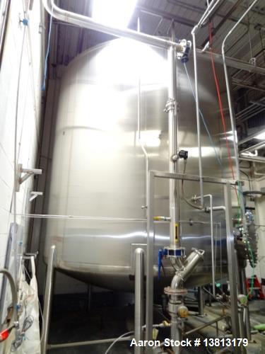 Used Feldmeier 9,000 Gallon Vertical Storage Tank, Stainless Steel. Dish top and dish bottom with center 6" 150lb discharge flange and adjacent 3" outlet. 8" 150 lb flange upper side inlet. Bottom si...