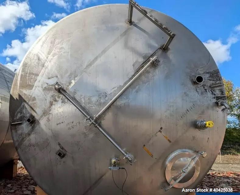 Used Feldmeier 12,000 Gallon Storage Tank. 316 stainless steel construction. Approximately 136" inner diameter x 180"straight side, dish top and bottom, 20" top manway, 3" center bottom outlet. Mount...