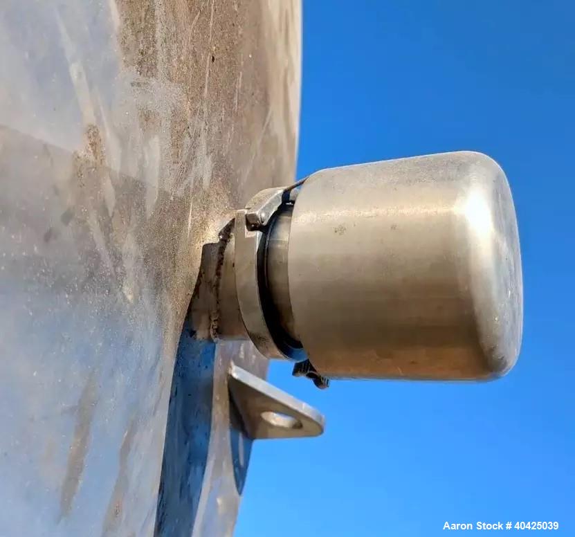 Used Feldmeier 12,000 Gallon Storage Tank. 316 stainless steel construction. Approximately 136" inner diameter x 180"straight side, dish top and bottom, 20" top manway, 3" center bottom outlet. Mount...