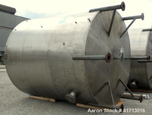 Used Filpaco Industries Tank, Approximate 6,000 Gallon, 304 Stainless Steel, Vertical.  Approximate 114" diameter x 132" straight side, slight cone top, slight dish bottom.  Top openings:  20" manway...