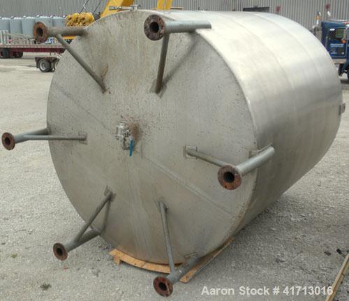 Used Filpaco Industries Tank, Approximate 6,000 Gallon, 304 Stainless Steel, Vertical.  Approximate 114" diameter x 132" straight side, slight cone top, slight dish bottom.  Top openings:  20" manway...