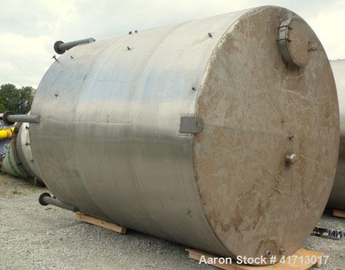 Used Filpaco Industries Tank, Approximate 6,000 Gallon, 304 Stainless Steel, Vertical.  Approximate 114" diameter x 132" straight side, slight cone top, slight dish bottom.  Top openings:  20" manway...
