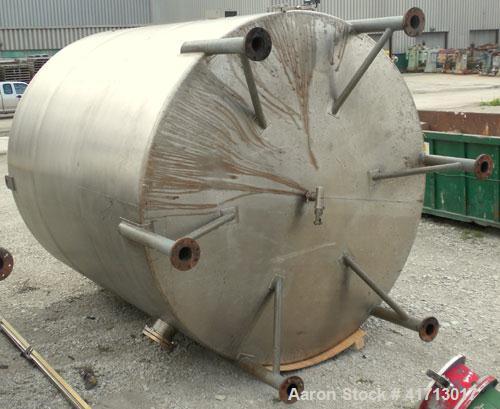 Used Filpaco Industries Tank, Approximate 6,000 Gallon, 304 Stainless Steel, Vertical.  Approximate 114" diameter x 132" straight side, slight cone top, slight dish bottom.  Top openings:  20" manway...