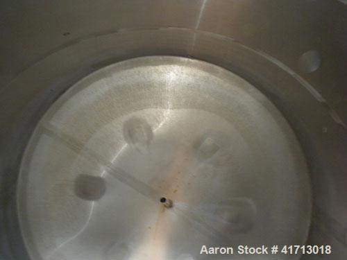 Used Filpaco Industries Tank, 6,000 Gallon, 304 Stainless Steel, Vertical.  Approximate 114" diameter x 132" straight side, slight cone top, slight dish bottom. Top openings:  20" manway with cover, ...
