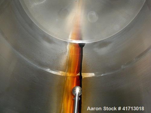 Used Filpaco Industries Tank, 6,000 Gallon, 304 Stainless Steel, Vertical.  Approximate 114" diameter x 132" straight side, slight cone top, slight dish bottom. Top openings:  20" manway with cover, ...