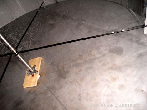 Used Highland Equipment Limited Tank, 11,887 Gallon, 304 Stainless Steel, Vertical.  132" diameter x 180" straight side, coned top and bottom.  Fixed stainless steel agitator bridge with a top enteri...