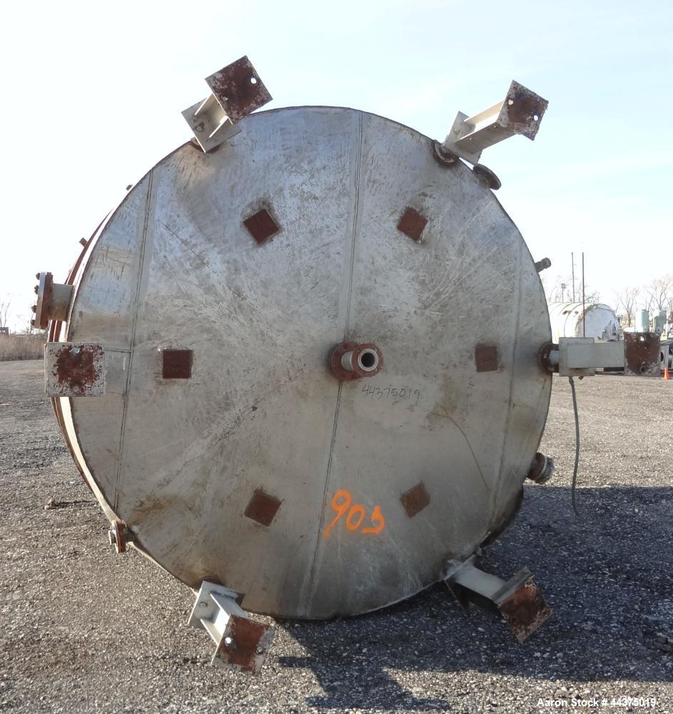 Used Tank, 10,500 Gallon, 304 Stainless Steel, Vertical. Approximate 126" diameter x 192" straight side, flat welded top, slight dished bottom. Fixed carbon steel agitator bridge with a Chemineer agi...