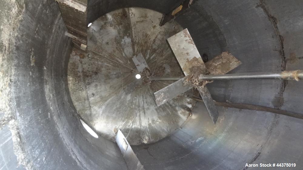 Used Tank, 10,500 Gallon, 304 Stainless Steel, Vertical. Approximate 126" diameter x 192" straight side, flat welded top, slight dished bottom. Fixed carbon steel agitator bridge with a Chemineer agi...