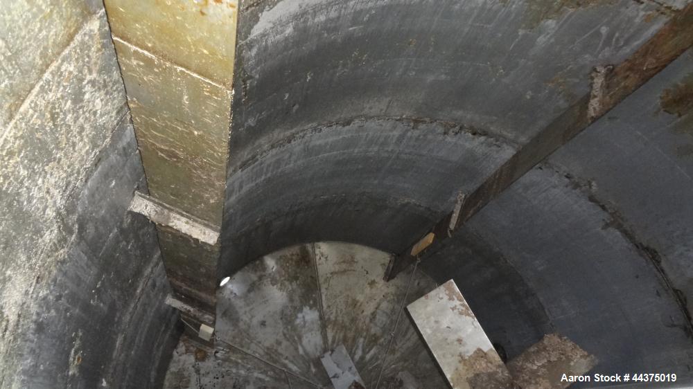 Used Tank, 10,500 Gallon, 304 Stainless Steel, Vertical. Approximate 126" diameter x 192" straight side, flat welded top, slight dished bottom. Fixed carbon steel agitator bridge with a Chemineer agi...