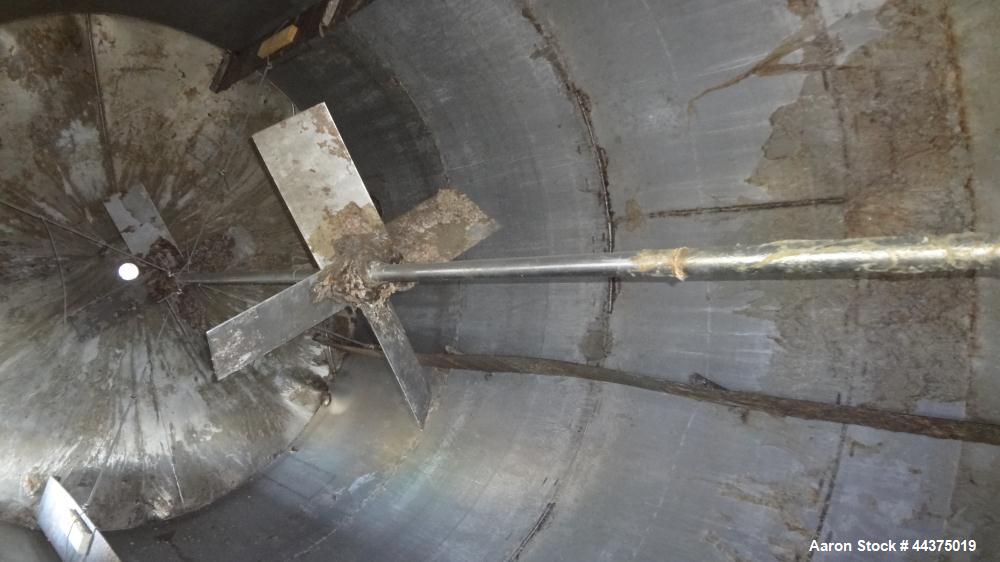 Used Tank, 10,500 Gallon, 304 Stainless Steel, Vertical. Approximate 126" diameter x 192" straight side, flat welded top, slight dished bottom. Fixed carbon steel agitator bridge with a Chemineer agi...