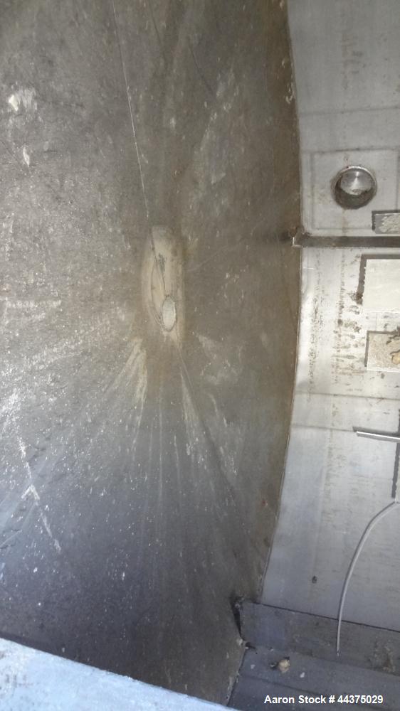 Used Imperial Steel Tank, 10,300 Gallon, 304 Stainless Steel, Vertical. Approximate 126" diameter x 192" straight side, flat welded top, dished bottom. Fixed carbon steel agitator bridge with a top e...