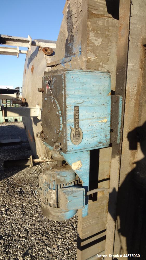 Used Imperial Steel Tank, 10,000 Gallon, 304 Stainless Steel, Vertical. Approximate 120" diameter x 204" straight side, flat welded top, coned bottom. Fixed carbon steel agitator bridge with a top en...