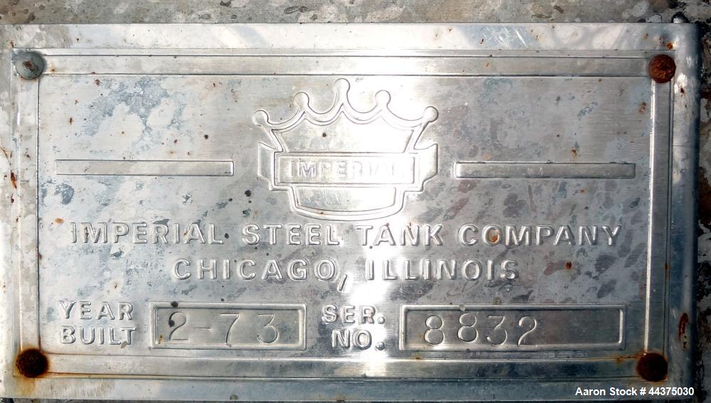 Used Imperial Steel Tank, 10,000 Gallon, 304 Stainless Steel, Vertical. Approximate 120" diameter x 204" straight side, flat welded top, coned bottom. Fixed carbon steel agitator bridge with a top en...