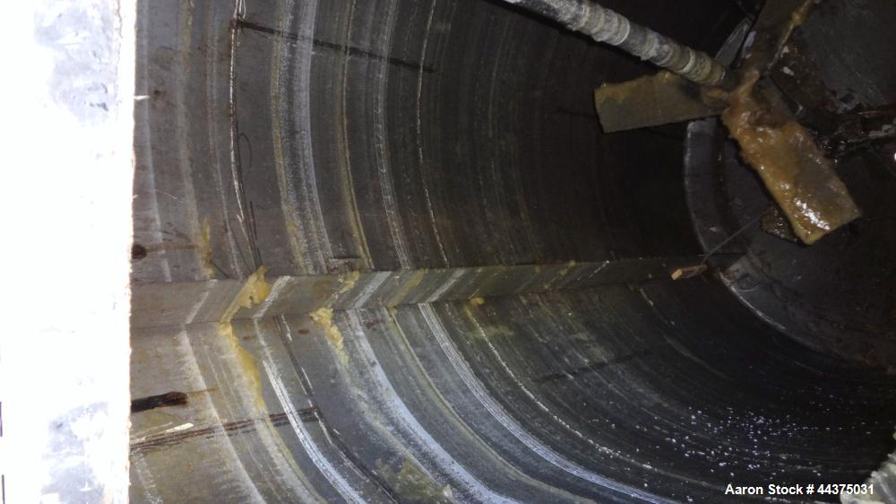 Used Imperial Steel Tank, 10,000 Gallon, 304 Stainless Steel, Vertical. Approximate 120" diameter x 204" straight side, flat welded top, coned bottom. Fixed carbon steel agitator bridge with a top en...