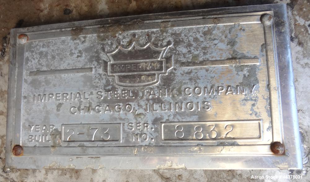 Used Imperial Steel Tank, 10,000 Gallon, 304 Stainless Steel, Vertical. Approximate 120" diameter x 204" straight side, flat welded top, coned bottom. Fixed carbon steel agitator bridge with a top en...