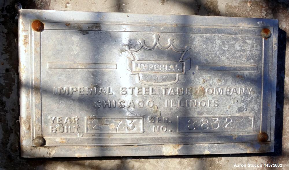 Used Imperial Steel Tank, 10,000 Gallon, 304 Stainless Steel, Vertical. Approximate 120" diameter x 204" straight side, flat welded top, coned bottom. Fixed carbon steel agitator bridge with a top en...