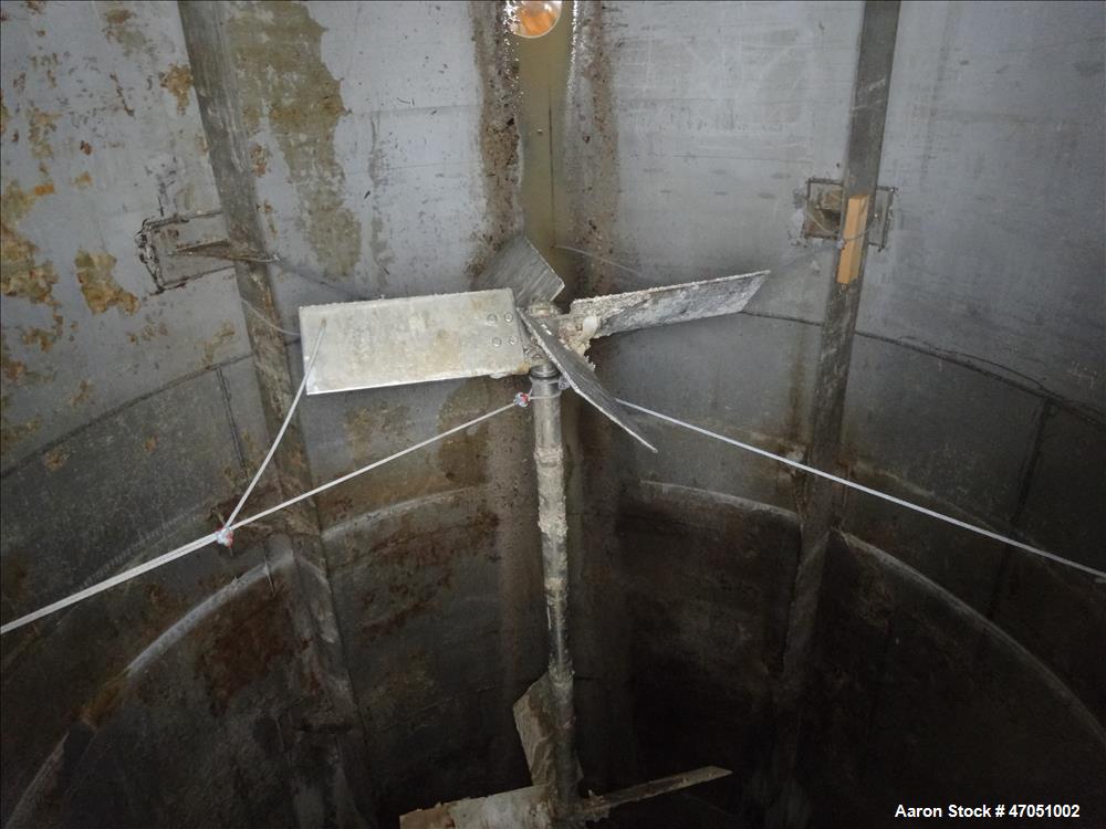 Used Imperial Steel Tank Company Tank, 12,000 Gallon, 304 Stainless Steel, Vertical. Approximate 132" diameter x 204" straight side. Flat top, cone bottom. Fixed carbon steel agitator bridge with a C...