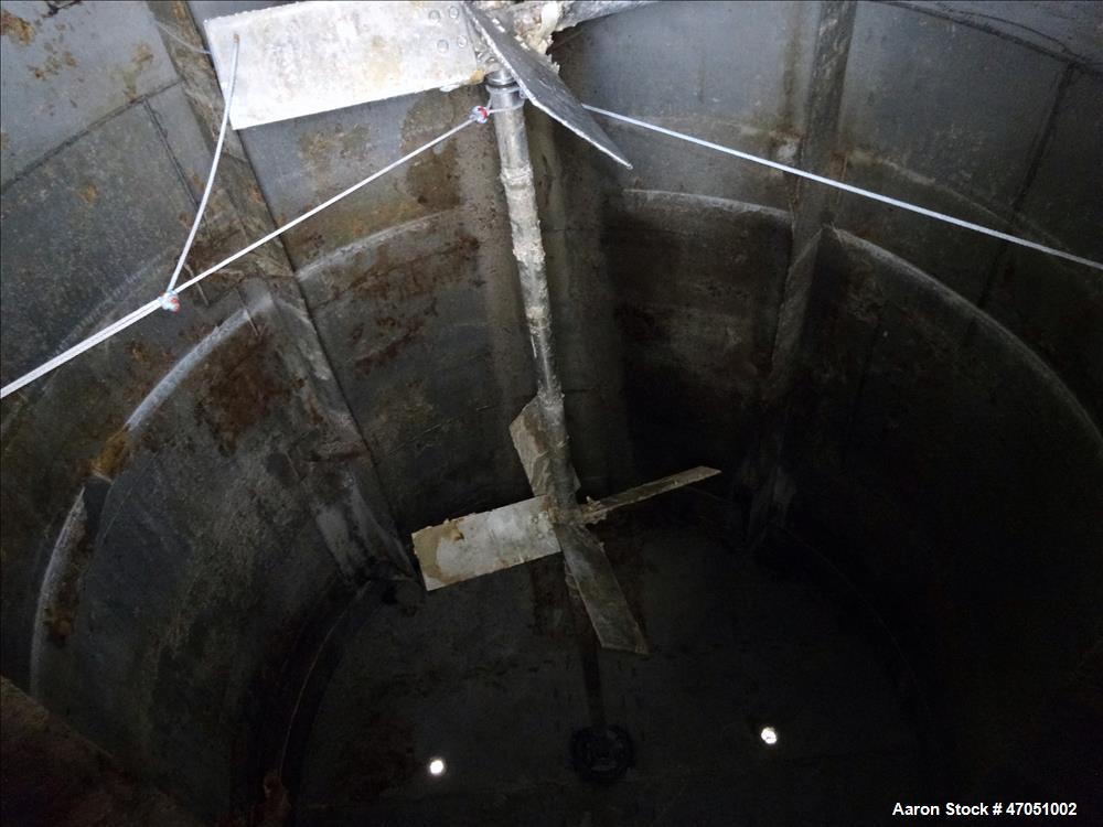 Used Imperial Steel Tank Company Tank, 12,000 Gallon, 304 Stainless Steel, Vertical. Approximate 132" diameter x 204" straight side. Flat top, cone bottom. Fixed carbon steel agitator bridge with a C...
