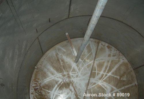 USED: Industrial Marine Inc tank, 6000 gallon, 304 stainless steel, vertical. Approximately 114" diameter x 153" straight side. Slight cone top, flat bottom. Openings: top (2) 2", 3", 10", 24" manway...
