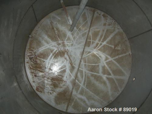USED: Industrial Marine Inc tank, 6000 gallon, 304 stainless steel, vertical. Approximately 114" diameter x 153" straight side. Slight cone top, flat bottom. Openings: top (2) 2", 3", 10", 24" manway...