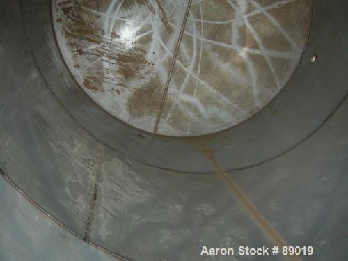 USED: Industrial Marine Inc tank, 6000 gallon, 304 stainless steel, vertical. Approximately 114" diameter x 153" straight side. Slight cone top, flat bottom. Openings: top (2) 2", 3", 10", 24" manway...