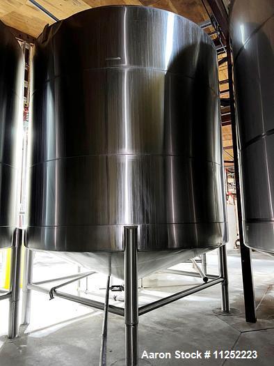 Used JV Northwest 10,000 Gallon Stainless Steel Tank. Vessel measures 144" diameter x 138" straight side. Slight coned top and bottom. 4" diameter center bottom outlet with manual valve and pipe tape...