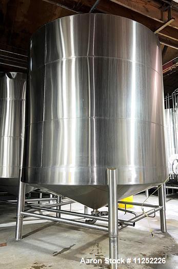 Used JV Northwest 10,000 Gallon Stainless Steel Tank with cone bottom. Vessel measures 144" diameter x 138" straight side with cone bottom leading to 4" diameter center bottom outlet with manual valv...